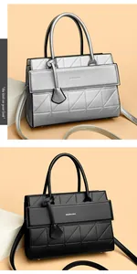 Close-up of minimalist handbag showing lychee texture, geometric quilting, and BALADO logo