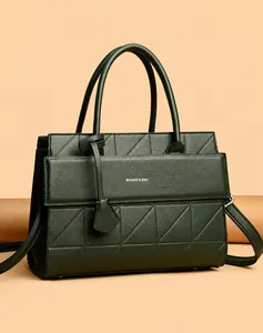 Detail showing the dark green lychee grain leather texture and triangular quilting