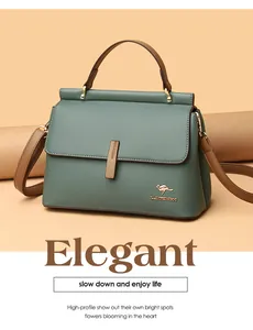Dettaglio borsa in pelle litchi grigio-verde con manico marrone e logo a canguro dorato