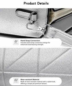 Detail of silver geometric tote bag featuring metallic finish and sturdy metal hooks