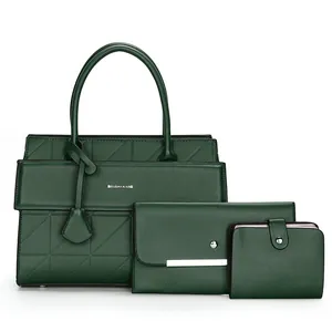 Detailed view of dark green tote bag set with matching wallet and envelope clutch bag