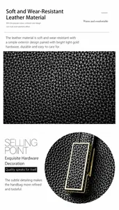 Detail shot of black tote bag showing soft litchi grain texture and gold metal hardware