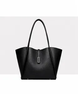 Front view of black bucket tote bag with lychee grain texture and metal buckle