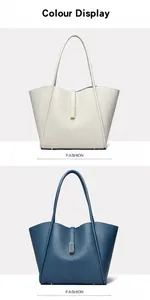 Detail view of large tote bags in off-white and blue with premium litchi grain texture