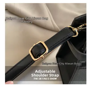 Detail view of adjustable black leather strap with premium gold-tone metal buckles