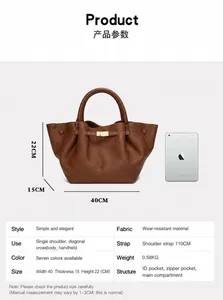 Brown winged tote bag dimension specifications showing 40cm width and leather texture