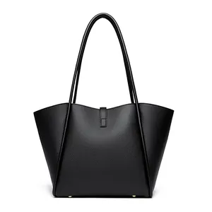 Minimalist black lychee texture bucket tote bag with wide wing shape and long straps