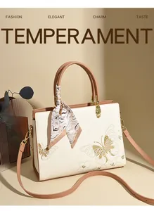 Détails de broderie papillon et écharpe en soie décorative sur le sac à main fourre-tout