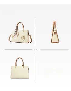 Vue détaillée du sac cabas kaki avec broderie papillon et picots de protection