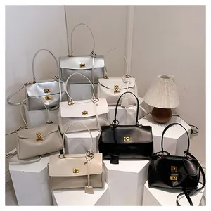 Minimalist tote bags in silver, white, beige, and black with elegant gold twist locks