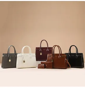 Detail view of stylish synthetic leather handbag set with matching wallets in five colors