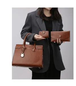 Detailed set of brown leather tote bag with matching envelope wallet and card holder