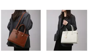 Detail view of stylish tote bag set with metal rivets and detachable shoulder strap