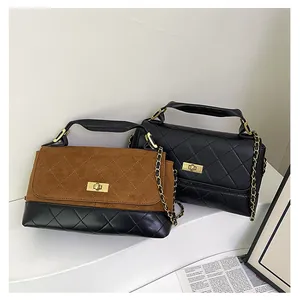 Detail shot of vintage quilted shoulder bags with gold chain and square metal turn-locks