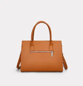 Rear view of brown handbag featuring smooth texture and metallic back zipper pocket