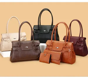Detailliertes Set aus Tragetasche, Clutch und Geldbörse aus hochwertigem beigem Kunstleder