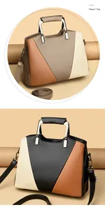 Macro detail of high-quality pebbled leather texture and elegant color-block bag design