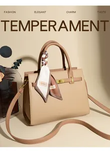 Detail showing beige litchi grain leather handbag with gold lock and floral scarf handle