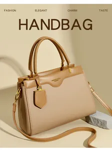 Detail of khaki PU leather tote bag with lychee texture and metallic handle rings