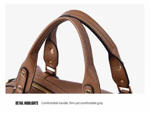 Detailed close-up of brown litchi pattern leather bag with gold rivets and handle