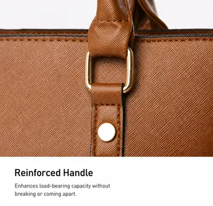 Detail of the reinforced handle attachment with gold-tone hardware on the brown tote bag