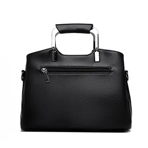 Classic black pebbled leather tote bag with modern silver U-shaped metal handles