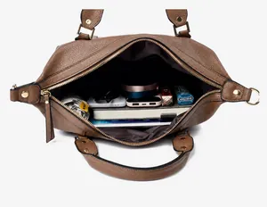 Large capacity interior of brown lychee grain bag showing iPad and daily essentials