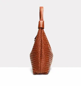 Close-up of brown leather woven hobo bag showing detailed intrecciato texture