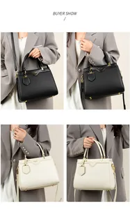 Detail view of large trapezoid tote bags in black and beige with lychee texture leather