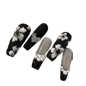 Handmade black rose press-on nails with 3D floral accents, rhinestones and pearls