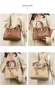 Détail d'un sac à main en cuir de luxe avec fermoir doré et boucle concentrique