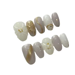 Handmade light therapy press-on nails set with purple gradient and 3D floral pearls