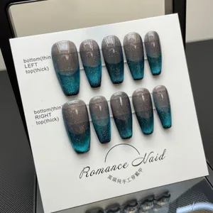 Handmade coffin nails featuring blue-grey cat eye gradient and silver glitter accents