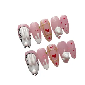 Pink Japanese press-on nails set featuring 3D white rabbit and red heart designs