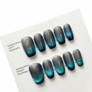 Blue cat-eye gradient long coffin press-on nails with glitter on a white card display