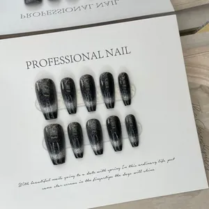 Handmade dark brown cat eye press-on nails with silver starry gradient in coffin shape