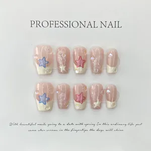 Handmade press-on nails with cute stars and pearls on a nude pink base, short square shape