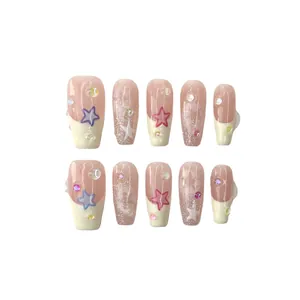 Handmade French nude press-on nails with purple stars, pearls and glitter in long trapezoid shape