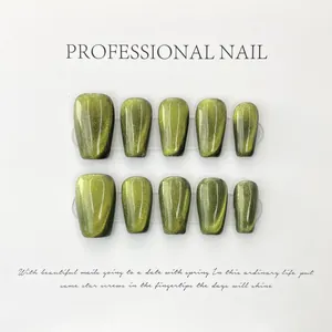 Detailed view of handmade light green cat-eye press-on nails with square-oval shape