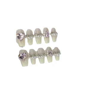 Handmade milky white French press-on nails with pink heart rhinestones and pearls
