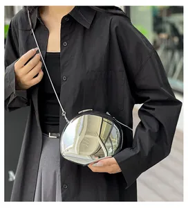 Chic silver egg-shaped acrylic crossbody bag with chrome mirror finish and chain