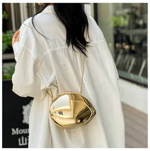 Modern gold irregular geometric clutch bag with metallic mirror finish and chain strap
