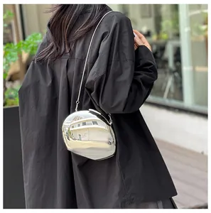 Silver mirror acrylic egg-shaped crossbody bag with a sleek metallic chain strap