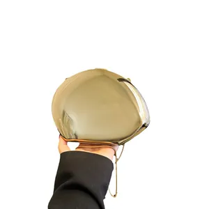 Golden mirror finish heart-shaped acrylic clutch bag with a slim metal chain strap