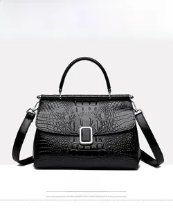 Front view of black bucket bag with crocodile pattern and metal rectangle buckle detail
