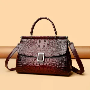 Vintage burgundy faux crocodile leather bucket bag with top handle and gold clasp