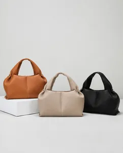 French style dumpling bags in brown, beige, and black with soft lychee grain leather