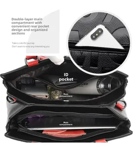 Top view of spacious black pebbled leather tote with red handles showing multiple compartments