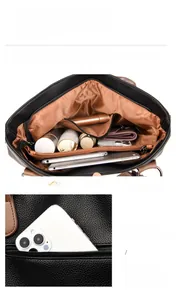 Detail view of large leather tote showing multiple inner compartments and back zipper pocket