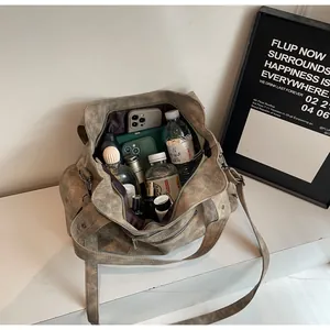 Interior view showing the large capacity and multiple compartments of the vintage tote bag